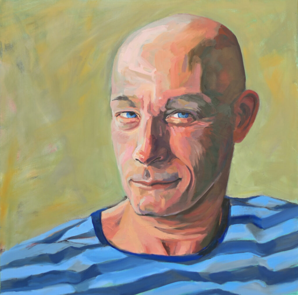 bald man in blue striped shirt