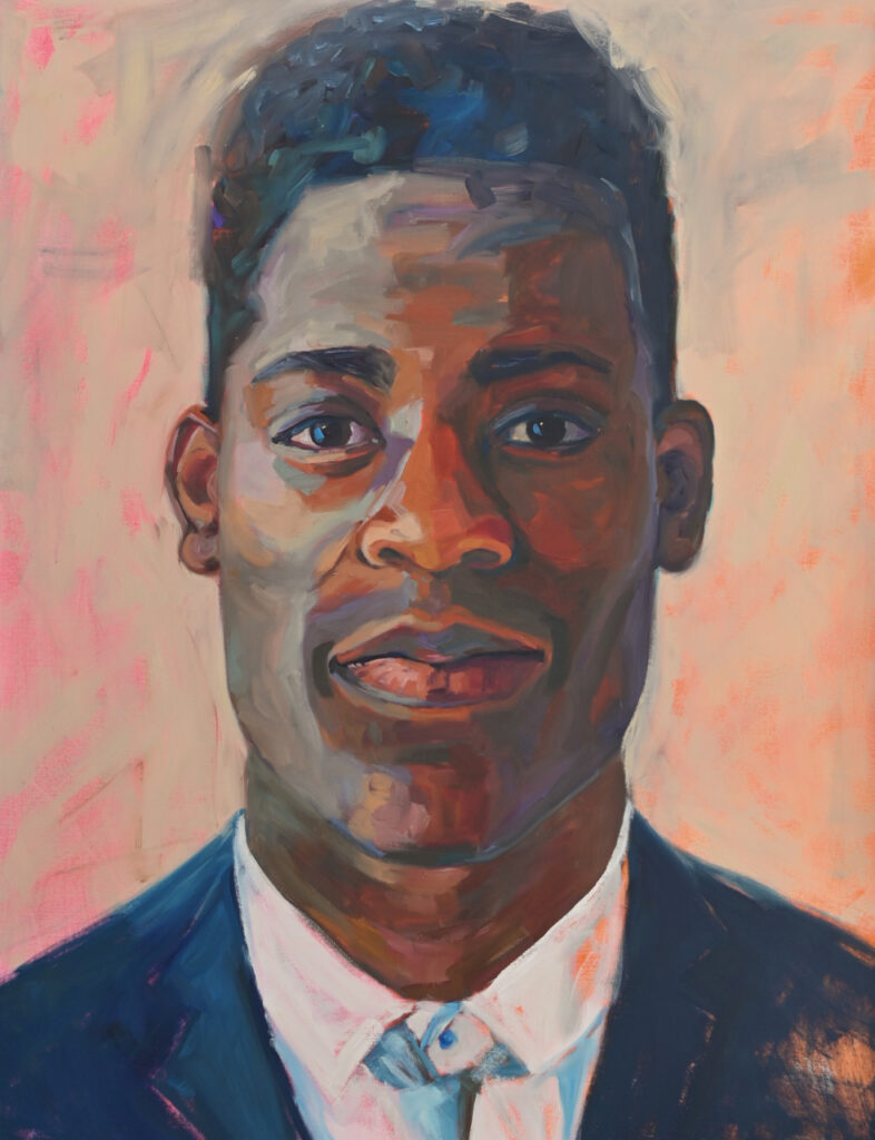 Portrait of a young black man in suit, white shirt and tie