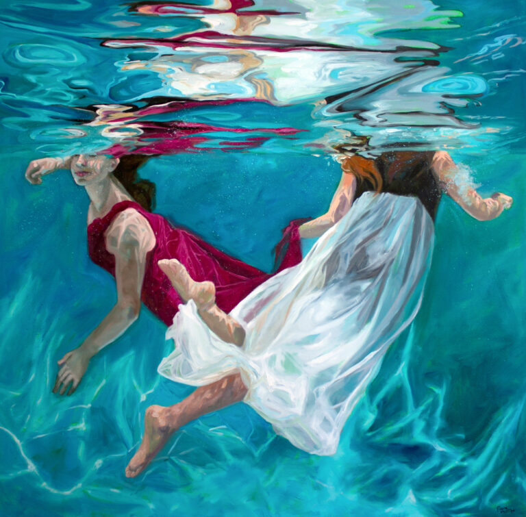 two girls in long dresses swimming underwater with colored reflections in the surface of the water above them.